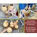 These are dried gourds in a variety of shapes and sizes. The gourds are cut open to show the dried seeds and membrane being removed. 